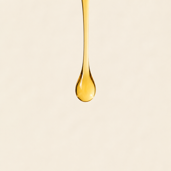 Hair strand coated and weighed down by cheap oil